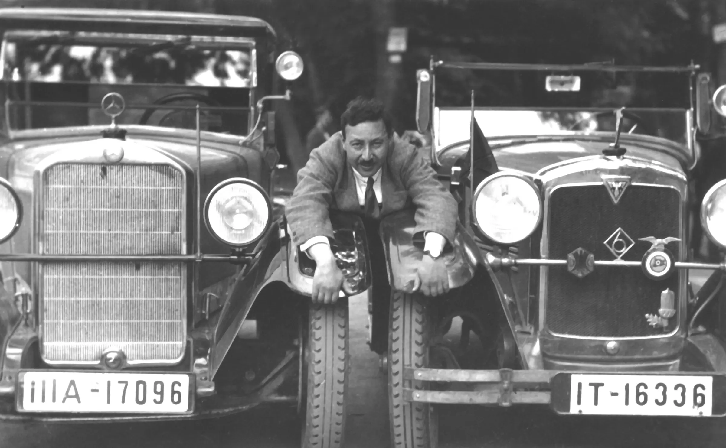 Josef Ganz between an Adler and a Mercedes-Benz, 1930